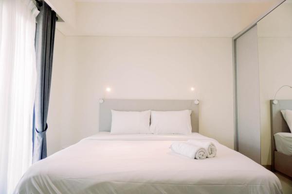 På bilden syns objektet Homey and Simply Look 1BR Bintaro Embarcadero Apartment By Travelio som ligger i staden Pondokpucung.