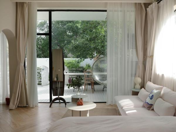 Foto 2: 不觉晓晨曦花园别墅 Bujuexiao Dawn Garden Villa Shanghai - Free daily shuttle bus to Disneyland, exquisite and beautiful garden courtyard, private spa bathtub in each room, hearty daily breakfast provided for all guests
