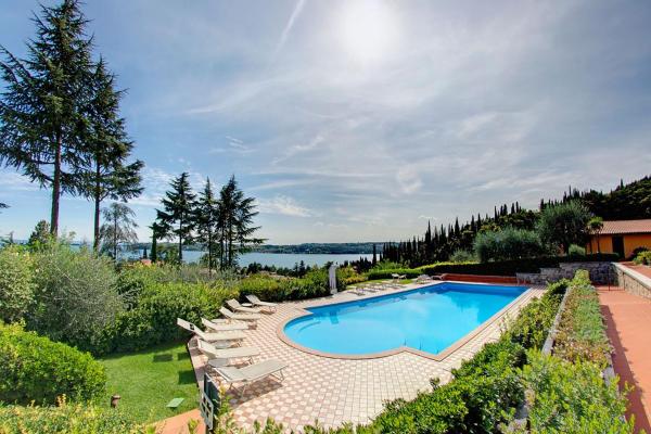 The photo shows the Lovely flat with shared pool and amazing lake view located in the city of Montecucco.