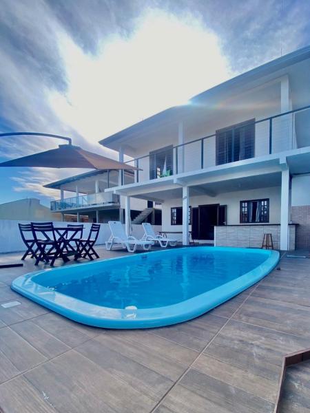 Auf dem Foto ist das Objekt House with pool for family and group of friends in der Stadt Matinhos zu sehen.