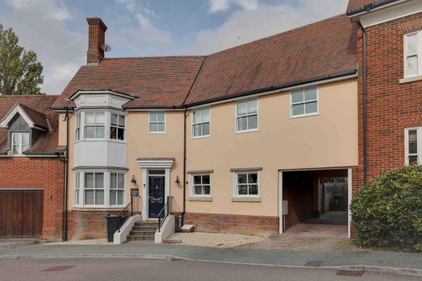 The photo shows the Elizabeth Four Bedroom Townhouse located in the city of Stisted.