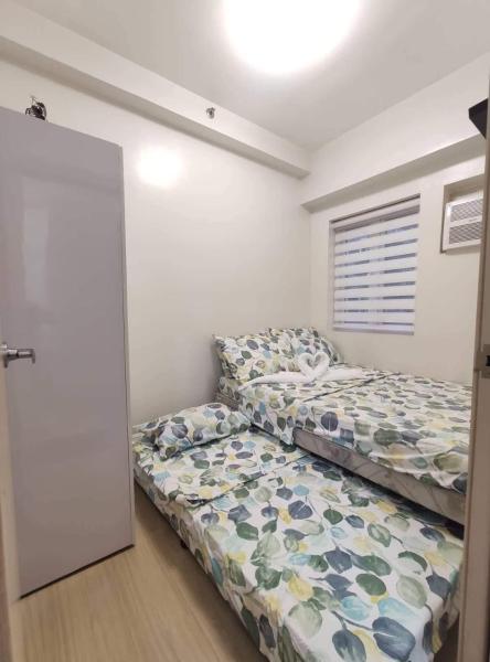 A la foto es mostra l'objecte 2BR Fully Furnished Condo Unit near SM Fairview situat a la ciutat de Mangangpico.