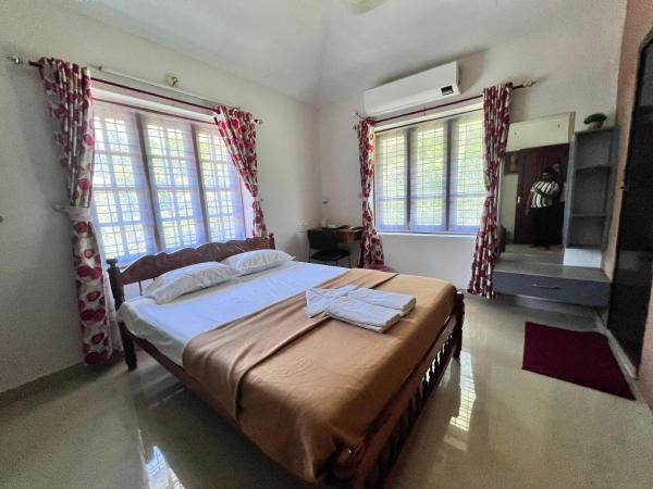 The photo shows the Madhavam Homestay located in the city of Vempayam.