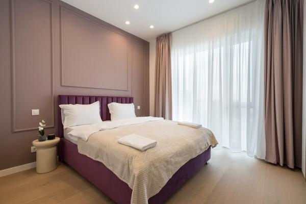 A la foto es mostra l'objecte Lavender Luxury King bed Apartment, underground parking Near Promenada Bussiness Center situat a la ciutat de Bucarest.
