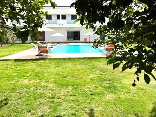A la foto es mostra l'objecte Villa W Téranga Saly Joseph**** situat a la ciutat de Sintiân.