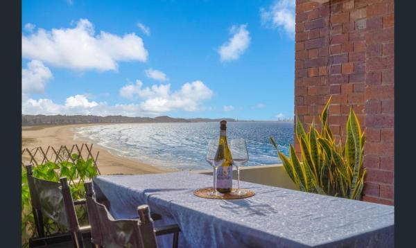 The photo shows the 3 bedrooms with Views over Kirra! located in the city of Coolangatta.