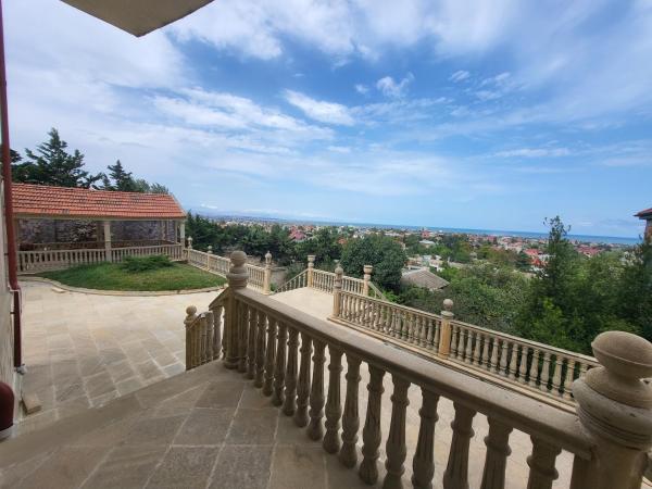 The photo shows the Novxani - Novkhani Villa Lux located in the city of Goradil.