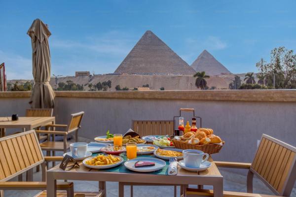 A la foto es mostra l'objecte La Boutique Hôtel - Vue Des Pyramides situat a la ciutat de El Caire.