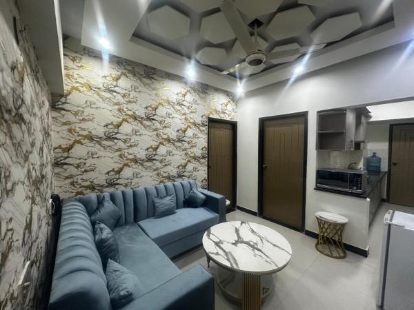 Designer Flat 104 Entire 2 Bedrooms lounge Kitchen AC Microwave Refrigerator Hot Water 24-7 electricity water gas lift with standby generator Security Surveillance Parking unmarried couples not allowed, Karachi