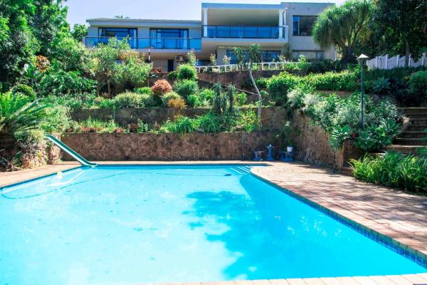 The photo shows the The Tropical Hut Lodges Westville located in the city of Queensburgh.