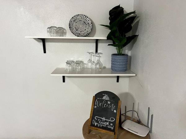 A la foto es mostra l'objecte Tangerine Sunsets Winton Rose situat a la ciutat de Nassau Estate.
