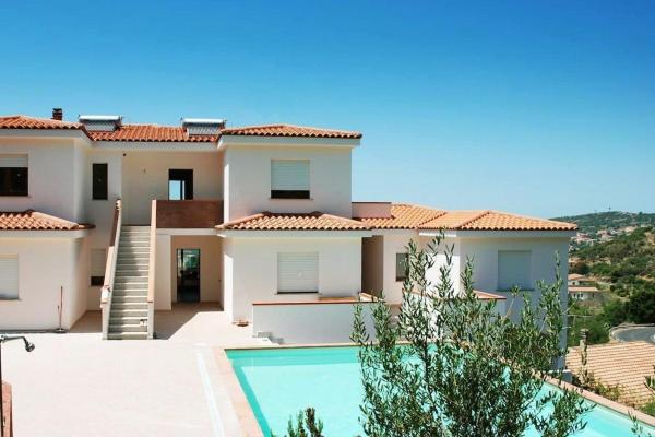 A la foto es mostra l'objecte Appartamento Suono del Blu nel residence con piscina a Badesi situat a la ciutat de Badesi.