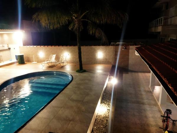 På billedet ses objektet Casa agradável com piscina beliggende i byen Bertioga.