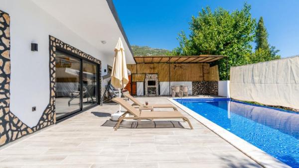 A la foto es mostra l'objecte Islamlar Village 2 Bedroom Villa 9346 situat a la ciutat de Kalkan.