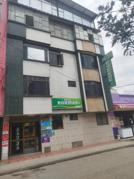 The photo shows the Hotel NORMAN located in the city of San Juan.