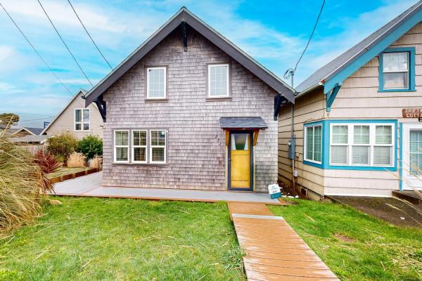 The photo shows the Rockaway Beach Bungalow located in the city of Rockaway Beach.