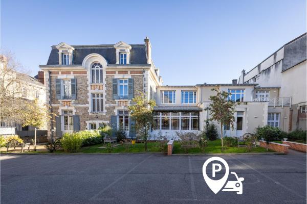 A la foto es mostra l'objecte La Maison Blanche - Appart Hôtel de charme Chic & Cosy climatisé, à 350m du coeur de ville de Limoges - Accès autonome situat a la ciutat de Limoges.
