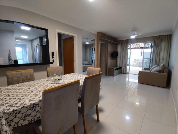 A la foto es mostra l'objecte Apartamento Garden 106 Praia do Morro na quadra da praia com ar condicionado em todos os quartos situat a la ciutat de Guarapari.