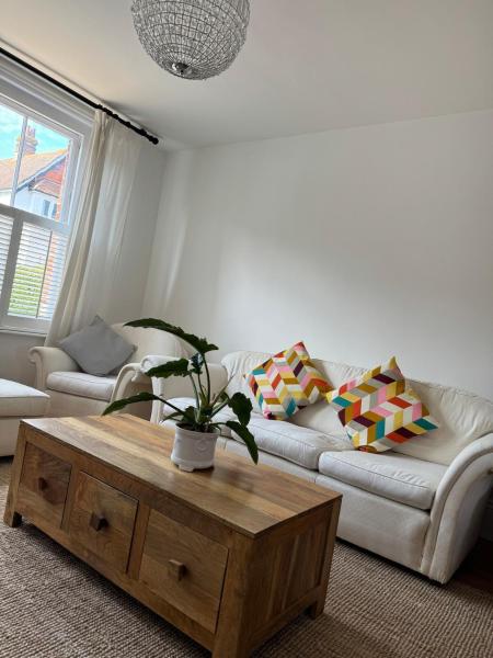 The photo shows the Marchwood House 4 bedroom sleeps 8 in the Village 10 mins walk to the beach located in the city of Bembridge.