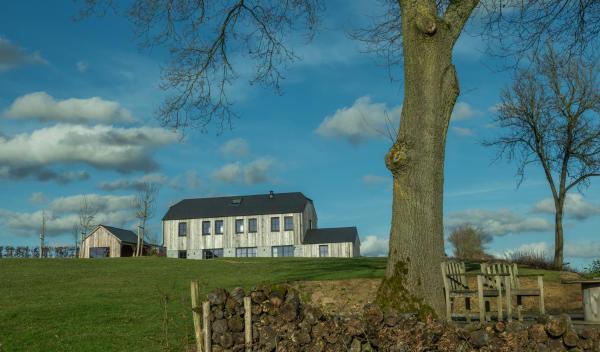 The photo shows the Gite de Trussogne located in the city of Houyet.