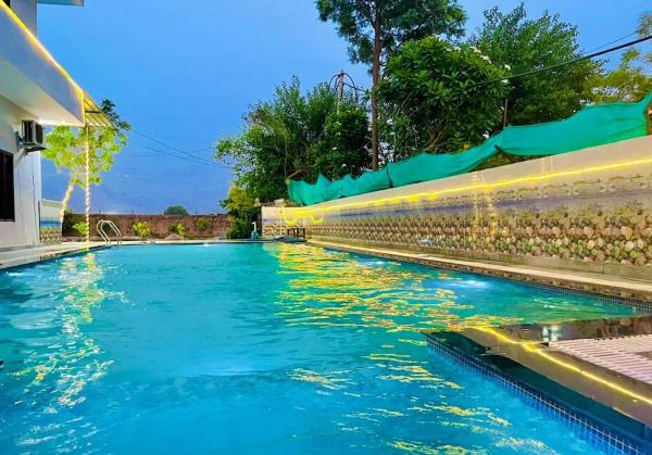 På bildet vises objektet Chandna Farm 4BHK with spacious pool som ligger i byen Tāoru.