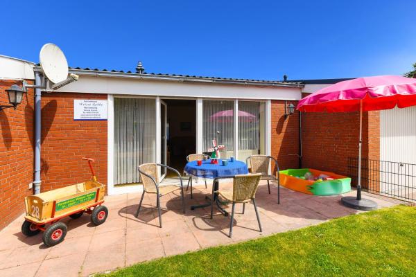 A la foto es mostra l'objecte Strandnahes Ferienhaus Mit Kinderspielplatz situat a la ciutat de Esens.