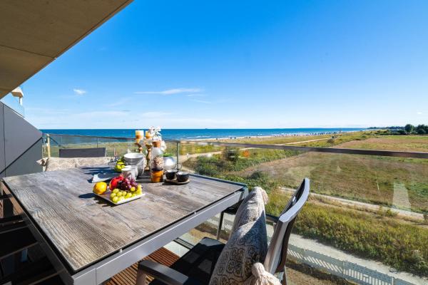 A la foto es mostra l'objecte BeachWaveOne- 2 OG, Meerblick, Balkon, Kamin, Sauna situat a la ciutat de Olpenitz.