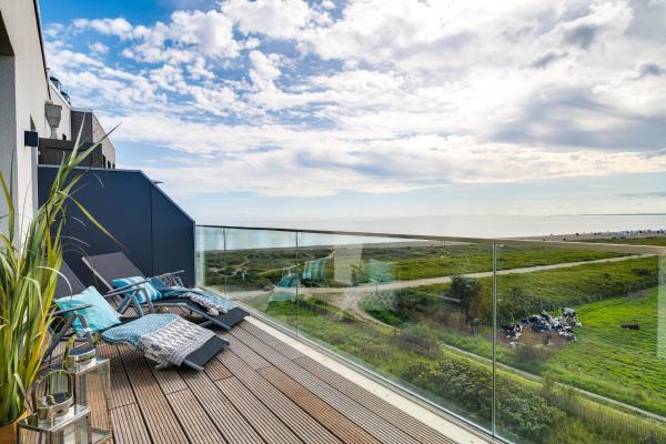 A la foto es mostra l'objecte BeachViewOne- 3OG, Meerblick, Balkon, Kamin, Sauna situat a la ciutat de Olpenitz.
