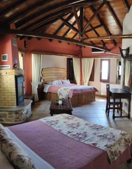 Op de foto is het object TERPOU StoneHouse and Suites Deluxe Family Suite te zien, gelegen in de stad Áyios Vlásios.