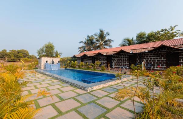 På bildet vises objektet Peacock Retreat 4BR Cottages with Private Pool & Scenic Views Saligao som ligger i byen Saligao.