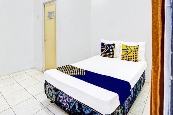 Auf dem Foto ist das Objekt Hotel O Kost Umik Sidoarjo Syariah in der Stadt Kedungredjo zu sehen.