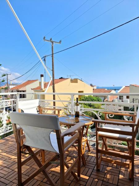 The photo shows the Blue Sky Apartments Pythagorion located in the city of Pythagoreio.