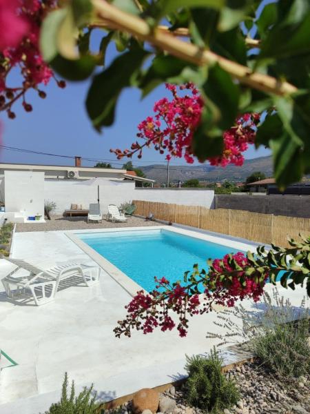 The photo shows the Boutique pool house Blagaj located in the city of Kosor.