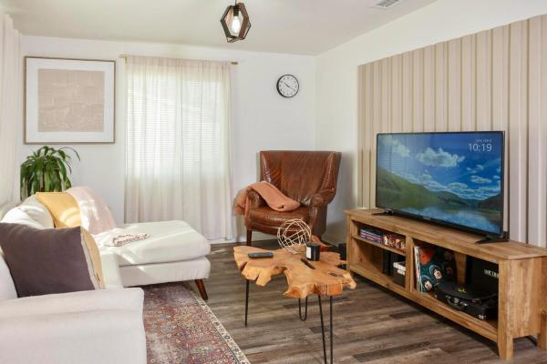 The photo shows the Central Modern All-In-One Home located in the city of Artesia.