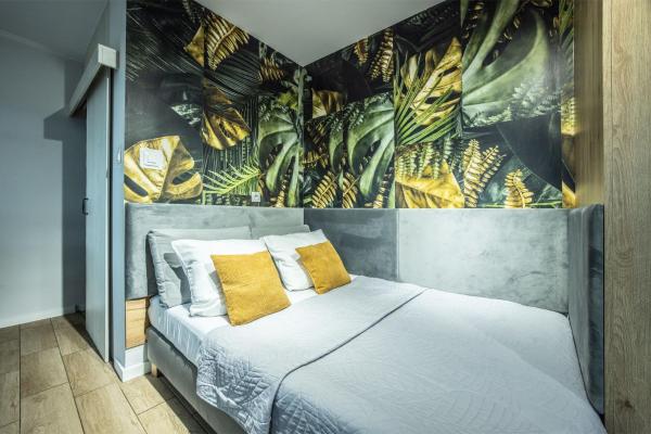 A la foto es mostra l'objecte WiguryTower Apartaments 70' situat a la ciutat de Łódź.
