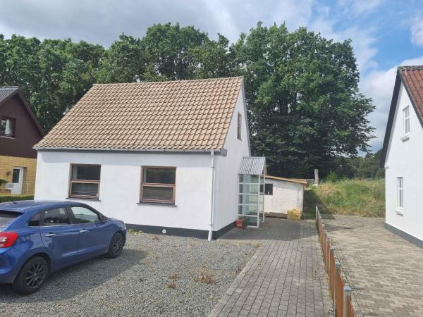 The photo shows the Enjoy The Charming Townhouse Close To The Beach located in the city of Aså.