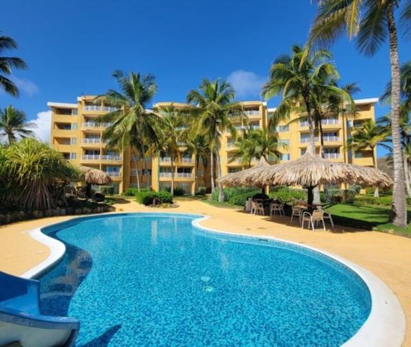 Auf dem Foto ist das Objekt Beachfront Apartment - Terrazas de Cimarrón, Margarita in der Stadt El Agua zu sehen.