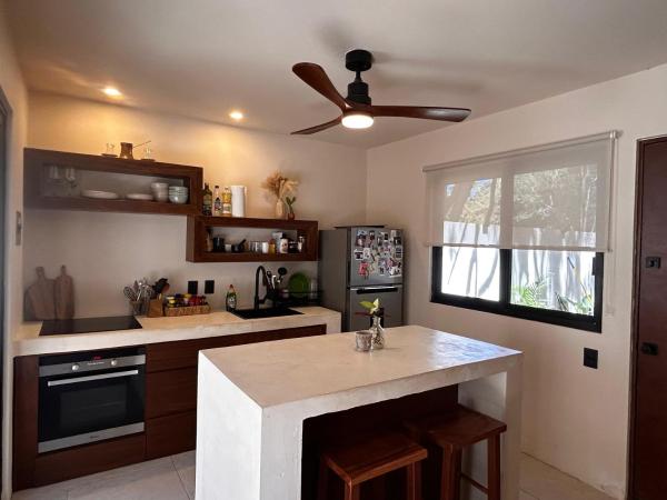 The photo shows the Caribe Apartments located in the city of Mahahual.