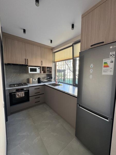 A la foto es mostra l'objecte Cozy Apartment in the Heart of Fergana situat a la ciutat de Fergana.