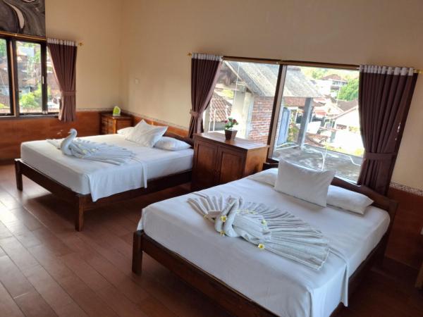 A la foto es mostra l'objecte Dharma homestay situat a la ciutat de Padangbai.