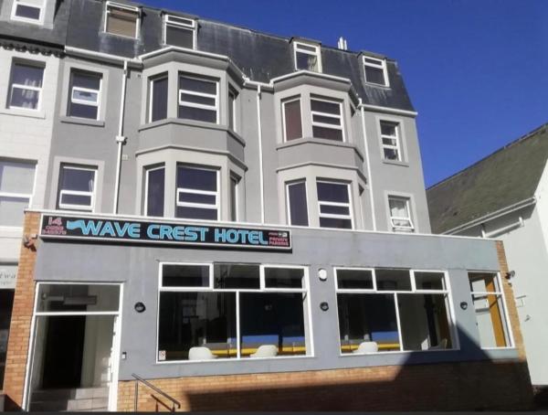 The photo shows the OYO Wave Crest Hotel located in the city of Blackpool.
