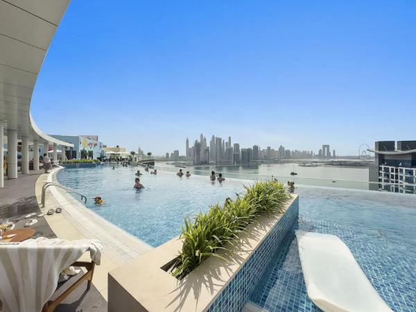 Seven Palm Apartments - Infinity Pool & Direct Beach Access - Dubai