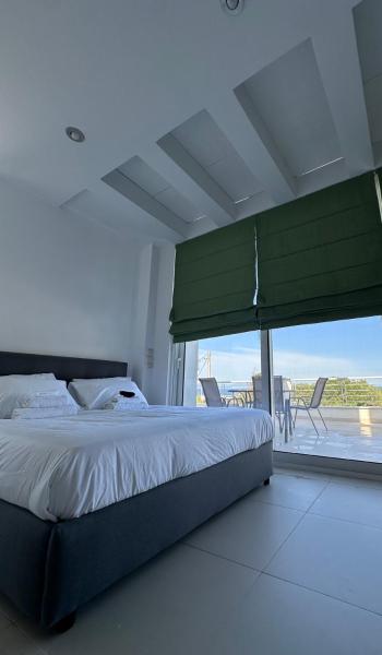 En la foto se muestra el objeto Ambrosia by Dia sea view apartment ubicado en la ciudad de Artemida.
