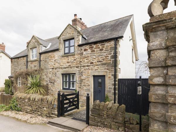 A la foto es mostra l'objecte Pigswood Cottage situat a la ciutat de Esh.