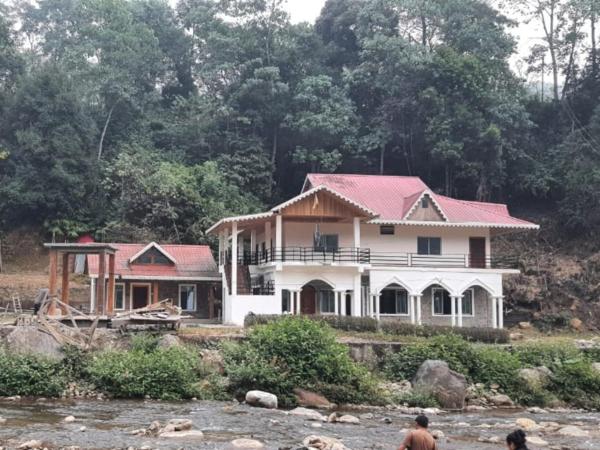 A la foto es mostra l'objecte Aranyak Homestay By StayApart situat a la ciutat de Simāna Basti.