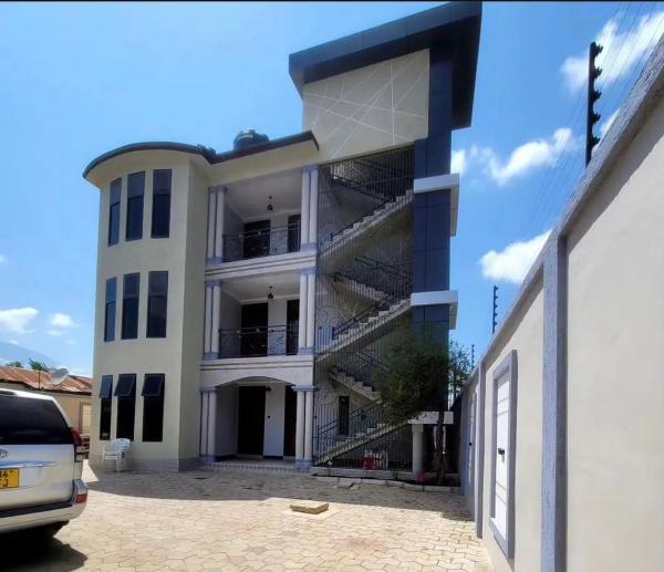 På billedet ses objektet QD Apartment beliggende i byen Arusha.