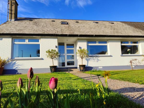 A la foto es mostra l'objecte Molly's Cottage situat a la ciutat de Glenariff.
