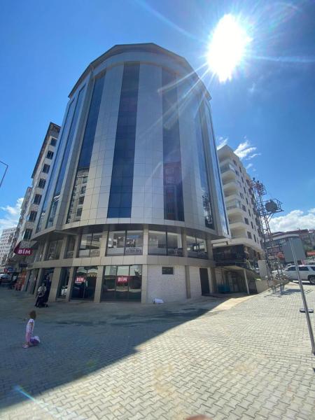 The photo shows the Hacıhan Hotel located in the city of Sancak.