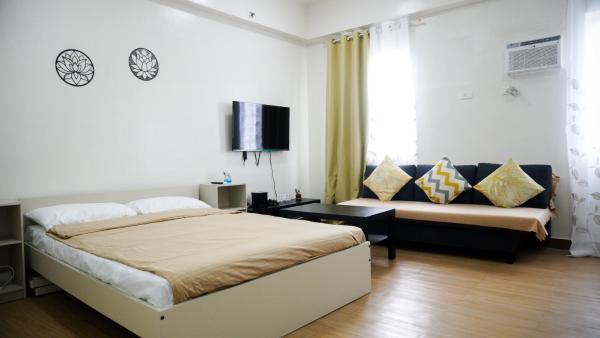 A la foto es mostra l'objecte Warm & Cozy Retreat near SM City Trece Martires situat a la ciutat de Bitangan.