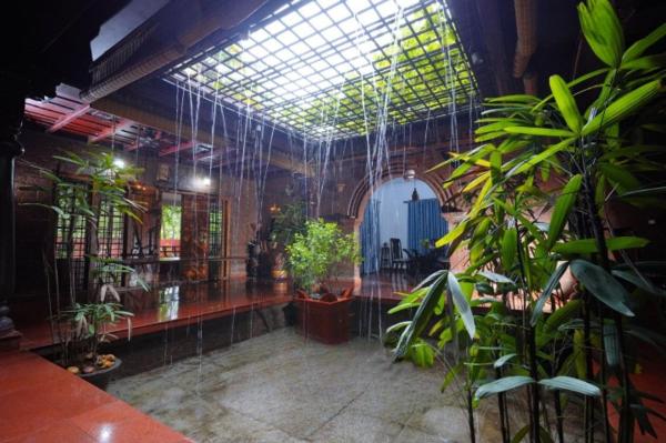 På billedet ses objektet Illam Heritage inn Bungalow l 4 BHK beliggende i byen Manattala.